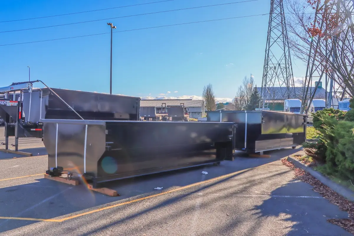 Roll-off dumpster ready for waste disposal at job site for Concrete Dumpster Rental in Andalusia